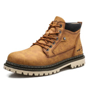Brown boot with black sole on a white background