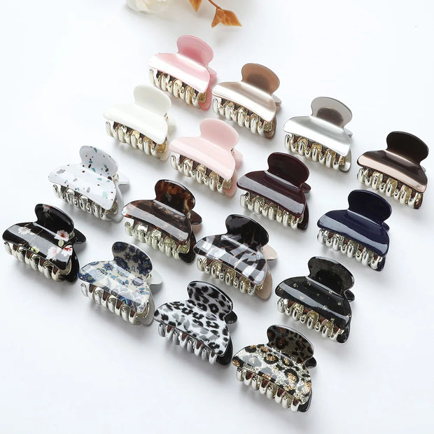 Collection of variously designed hair clips on a white background