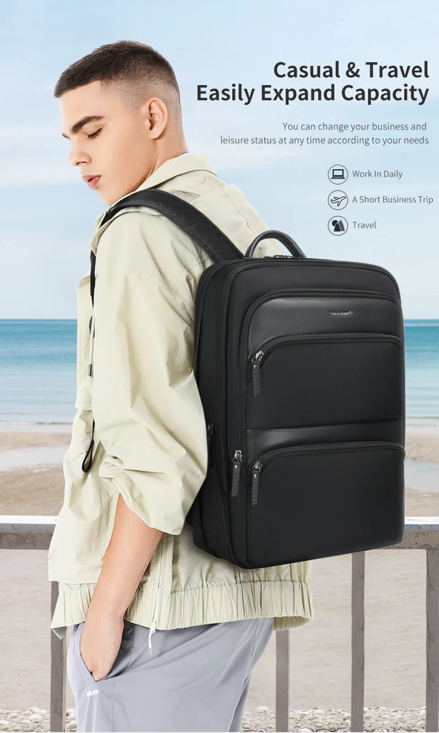 Person wearing a black backpack with a beach and ocean view in the background