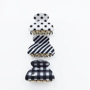 Black and white patterned hair clip on a white background