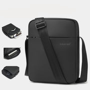 Black shoulder bag on a light gray background