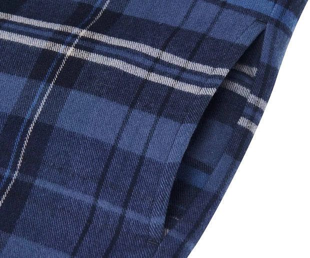 Close-up of blue plaid fabric with white lines on a white background