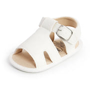 White sandal with a buckle on a white background