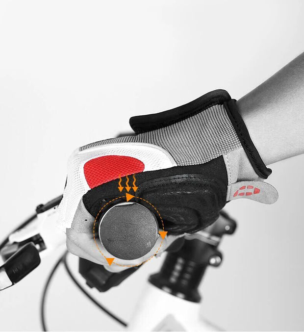 Close-up of a gloved hand gripping a bicycle handlebar with a blurred background