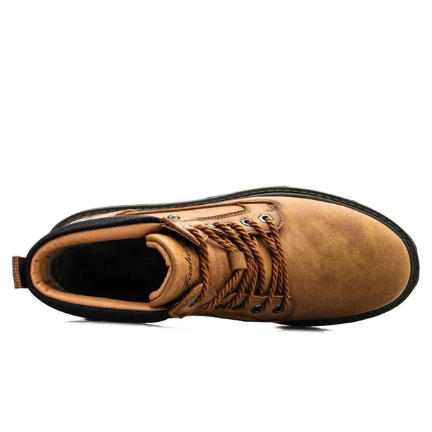 Brown boot with black sole on a white background