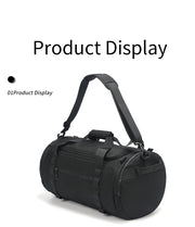 Black duffel bag with a strap on a white background