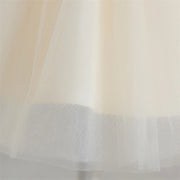 Close-up of a sheer fabric with a mesh pattern on a light background