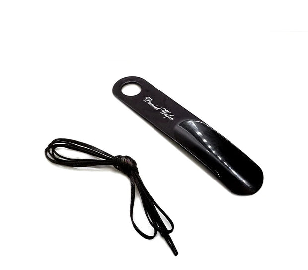 Black shoes horn with a shoelace on a white background, featuring promotional text.