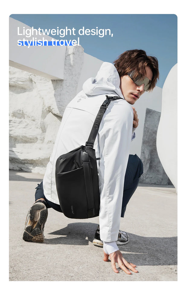 Person wearing a black backpack with text about lightweight design and stylish travel.