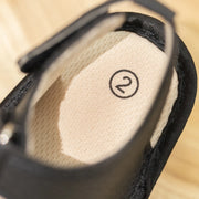 Close-up of a makeup compact with shade number '2' on a beige background
