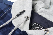 Close-up of a gray hood with a plaid pattern