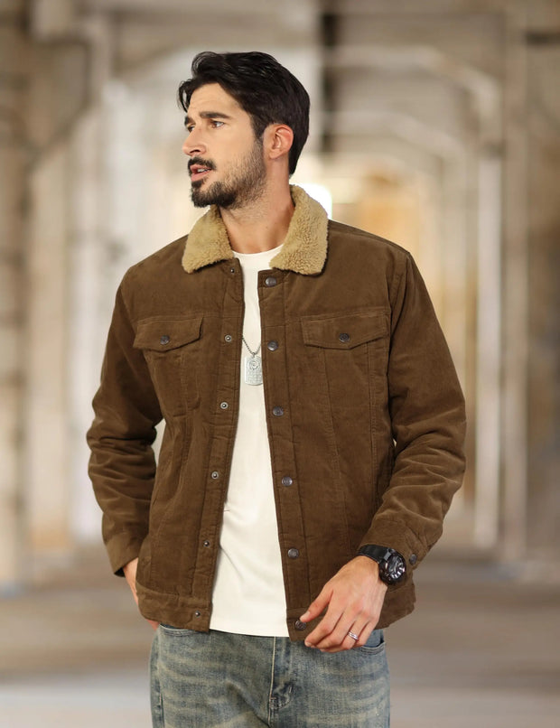 Man wearing a brown jacket with a blurred background