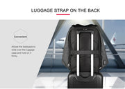 Black backpack with a luggage strap on a suitcase at an airport.