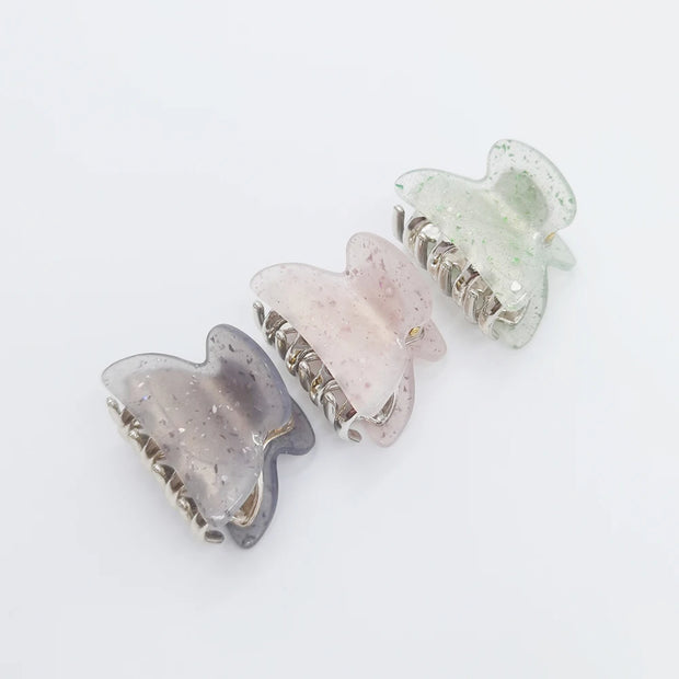 Three crystal hair clips on a white background