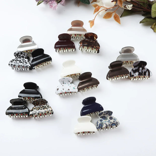 Collection of variously designed hair clips on a white background