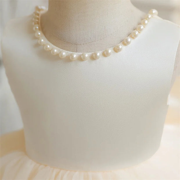 Pearl necklace on a mannequin bust with a soft focus background