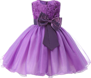 Purple dress with floral top and large bow on a white background