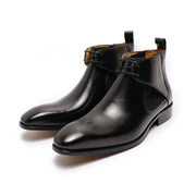 Pair of black leather boots on a white background