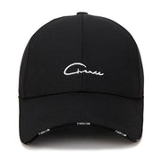 Black cap with white embroidered text on a white background