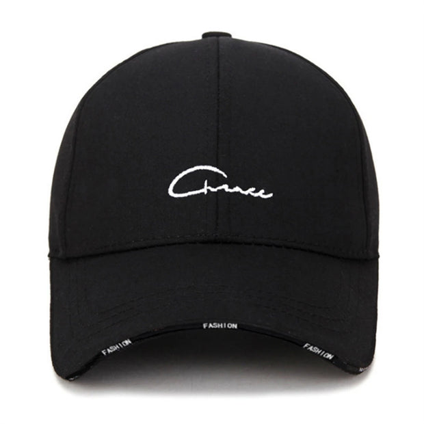Black cap with white embroidered text on a white background