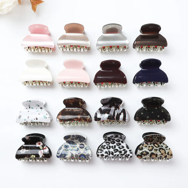 Collection of variously designed hair clamps on a white background