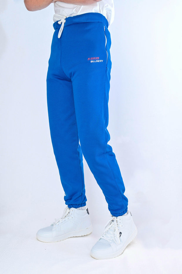 Blue tracksuit pants with white text on a white background
