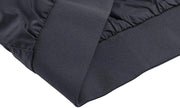 Close-up of a dark blue quilted jacket with a focus on the stitching and material texture.
