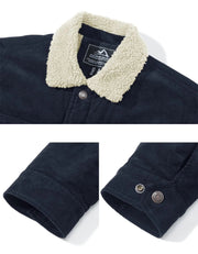 Navy jacket with cream sherpa lapel collar and snap cuffs on a white background