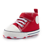 Red high-top sneaker with white laces on a white background