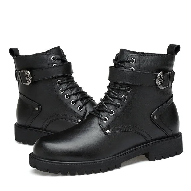 Black leather boots with buckles on a white background