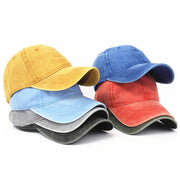 Set of five colorful baseball caps on a white background