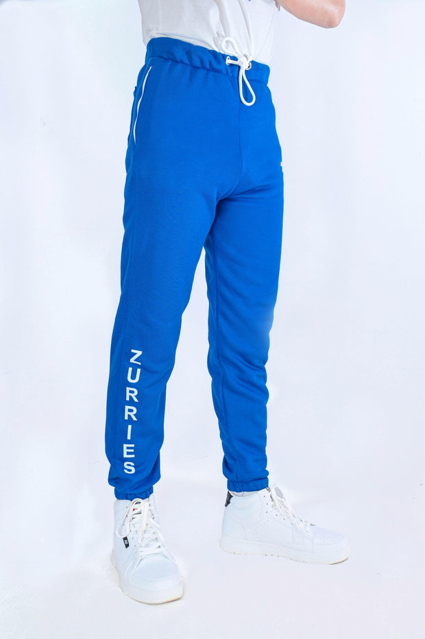 Blue jogger pants with 'Zurries' branding on a white background