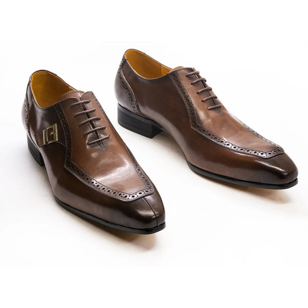 Pair of brown dress shoes on a white background