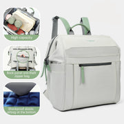 Gray backpack with green accents, on a light gray background.