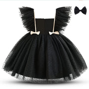 Black tulle dress with bow details on a white background