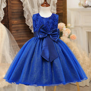 Blue dress with a large bow on a mannequin against a decorative background