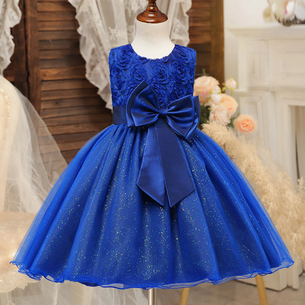 Blue dress with a large bow on a mannequin against a decorative background