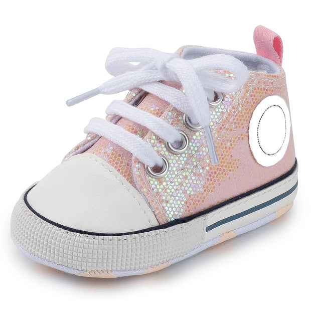 Pink and white sneaker with glittery pattern on a white background