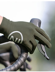 Green cycling glove with a logo on a blurred background