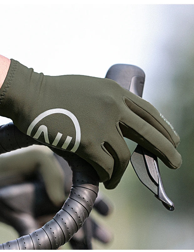 Green cycling glove with a logo on a blurred background