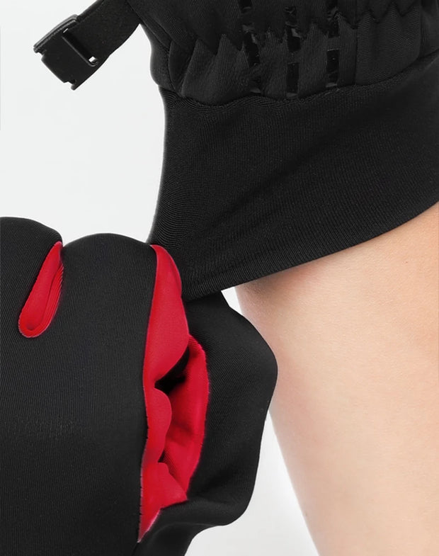 Black dress with red accents and a belt on a white background