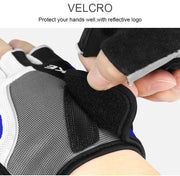 Glove with velcro closure and reflective logo, held by a hand.