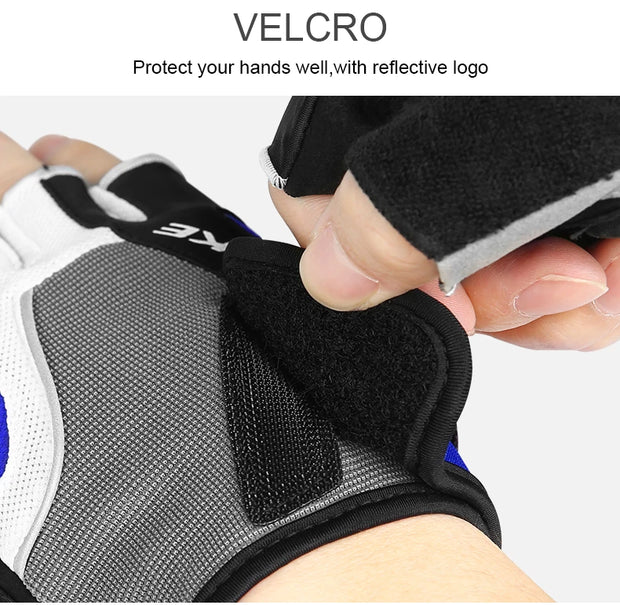 Glove with velcro closure and reflective logo, held by a hand.