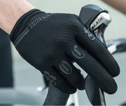 Black cycling glove on a blurred background