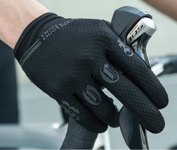 Black cycling glove on a blurred background