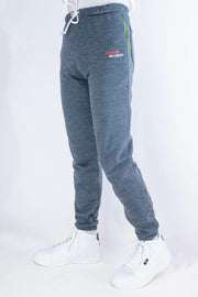 Gray jogger pants with a brand logo on a white background