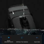 Black suitcase being sprayed with water against a black background