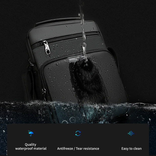 Black suitcase being sprayed with water against a black background