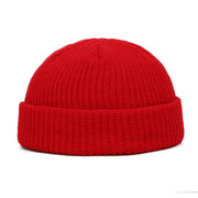 Red knit beanie on a white background
