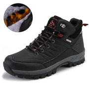 Black hiking boot with red accents on a white background
